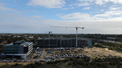 Aerial-shot-of-crane-working-on-construction-site-on-Balcatta-road,-Perth-Western-Australia
