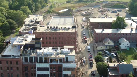 Aerial-tilt-up-reveals-line-up-of-vehicles-and-floats-for-Independence-Day-Parade-in-small-town-America