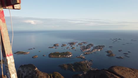 View-from-the-top-of-Festvågtind-mountain-near-overlooking-all-the-surrounding-islands-of-the-small-village-Henningsvaer-in-Lofoten,-Norway-during-a-sunset