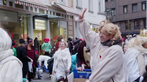 Rosenmontag-Carnaval-Drummer-in-Düsseldorf,-Germany-With-White-Vintage-Custom-in-Slow-Motion