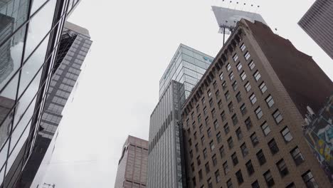 Corporate-Buildings-and-Towers-in-Downtown-Manhattan,-New-York-USA,-Low-Angle