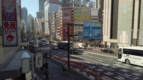 Traffic-and-pedestrians-at-Shinjuku-station-on-a-sunny-day-in-Tokyo-Japan