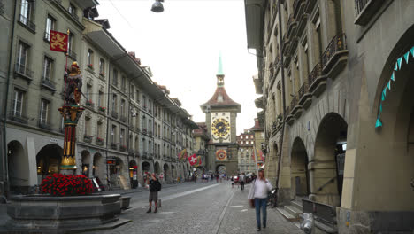 Bern-Switzerland,-circa-:-Timelapse-People-on-the-shopping-alley-with-clock-tower-of-Bern-in-Switzerland