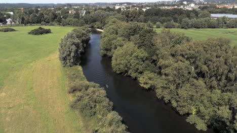 Drone-Flyover-Lone-Paddler-On-Ruhr-River-Near-Schwerte,-Nrw