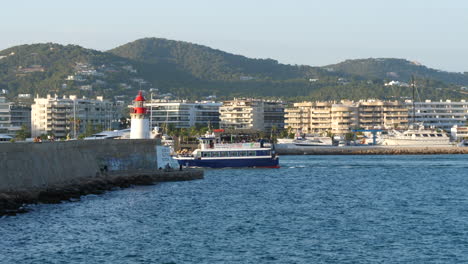 Ferry-boat-entering-Ibiza-harbor-on-sunny-day