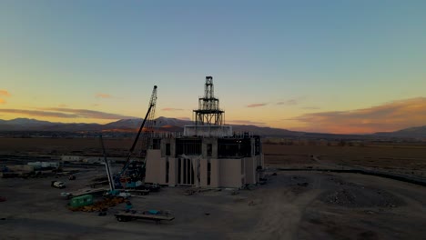 The-LDS-Temple-under-construction-in-Saratoga-Springs,-Utah-at-sunset