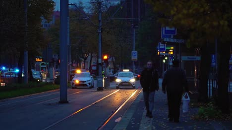 Police-Patrol-Cars-On-The-Street-In-Szczecin,-Poland-At-Dusk---Abortion-Ban-Protest-In-Poland---static-shot,-slow-motion