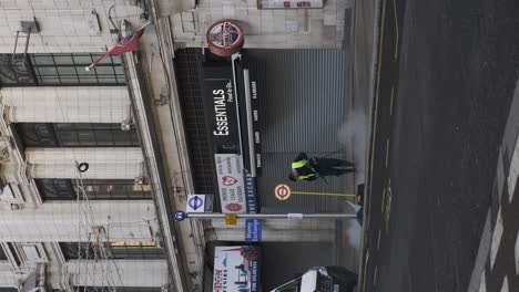 Worker-Cleaning-Sidewalk-With-High-Pressure-Water-Jet-During-Lockdown