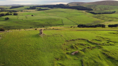 Solomon's-Temple-in-Buxton,-Derbyshire,-UK-shot-from-a-drone-at-sunset