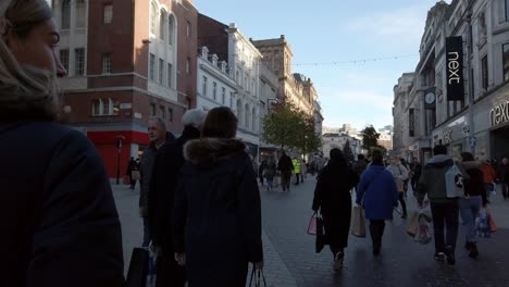 Christmas-shopping-people-walking-urban-Liverpool-city-wearing-corona-virus-masks