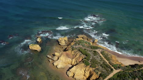 AERIAL-PEDESTAL-UP-Over-Rocky-Point-Lookout,-Torquay-Australia