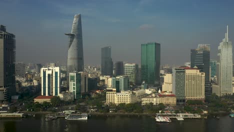 Drone-view-of-Saigon-River,-Ho-Chi-Minh-City-on-a-sunny-day