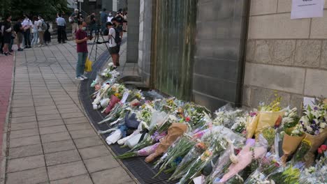 Mourners-place-flower-bouquets-outside-the-British-Consulate-General-as-they-pay-tribute-after-the-passing-of-the-former-and-longest-serving-monarch-Queen-Elizabeth-II