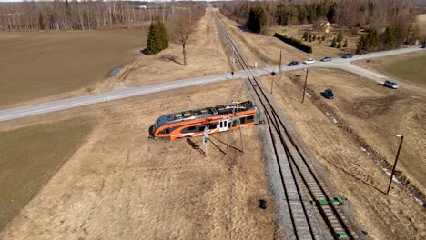 Drone-shot-of-Elron-train-wreck-next-to-railway-between-fields