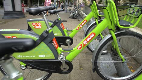 Slow-motion-reverse-between-green-eco-friendly-rental-bikes-in-Budapest
