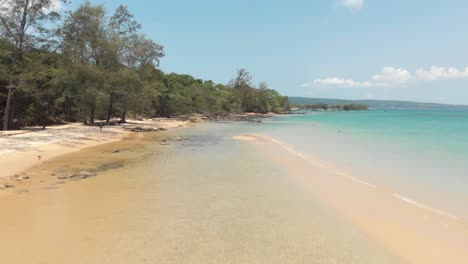 Aerial-forward-at-tropical-sand-beach-of-M'pai-bay,-Koh-Rong-Samloem,-Cambodia