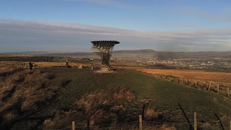 Aerial-singing-ringing-tree-musical-panopticon-sculpture-in-Lancashire-hiking-countryside-orbit-wide-right-low-angle