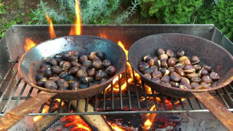 Chestnuts-roasted-on-open-fire,-seasonal-delicacy,-harvest,-4k-UHD,-crane-shot-from-low-to-high-angle