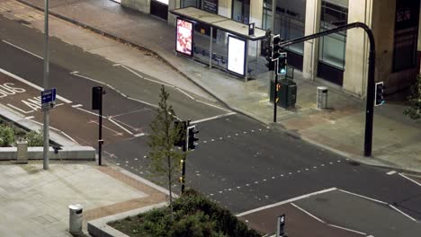 Night-time-lapse-of-traffic-lights-and-pedestrian-crossing