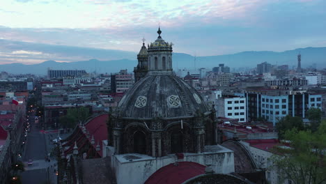 Aerial-shot-of-a-Colonial-Mexico-City-center-Church-at-dawn