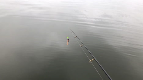 Fishing-pole-on-fishing-boat-in-summer