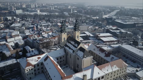 Wide-shot-of-Church-in-Nitra,-Winter,-Aerial-point-of-interest,-Slovakia