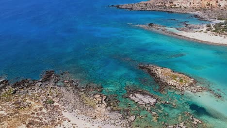 Epic-aerial-footage-of-an-island-paradise-with-a-fntastic-white-sand-beach,-Elafonisse-Crete