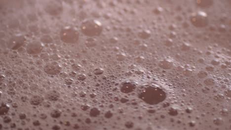 Pink-frothy-bubbles-in-water