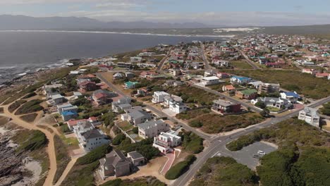 AERIAL:-Top-shot-of-coastal-valley-next-to-garden-route,-South-Africa