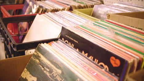 Records-in-Crates-for-Sale-at-Flea-Market-CLOSE-UP-TILT-UP