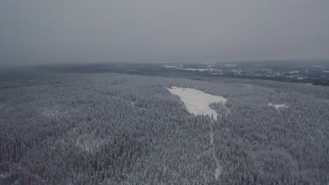 Aerial-view-of-frozen-mountain-top-in-deep-forest