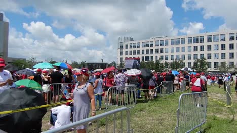 People-gather-to-hear-and-see-President-Donald-Trump-at-a-political-rallly-