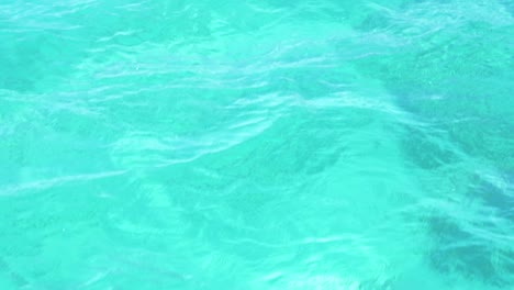 Turquoise-water-texture-as-boat-cruises-through-clear-water