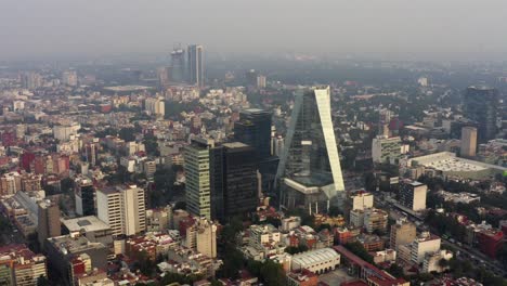 Aerial-shot-of-skyscrapers-in-a-very-polluted-day-in-Mexico-City