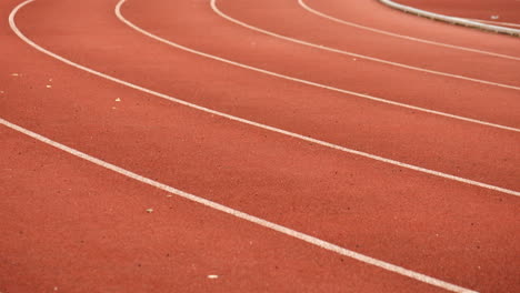 Athletics-running-track-corner.-TILT-SHOT