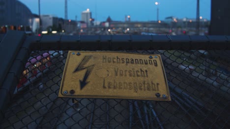 Sign:-high-voltage---hochspannung---danger---over-train-tracks