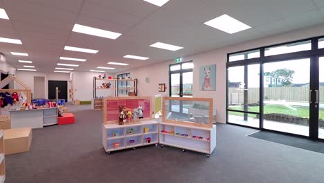 Dolly-out-shot-showing-a-big-room-for-kids-in-a-Playcentre-building,-New-Zealand