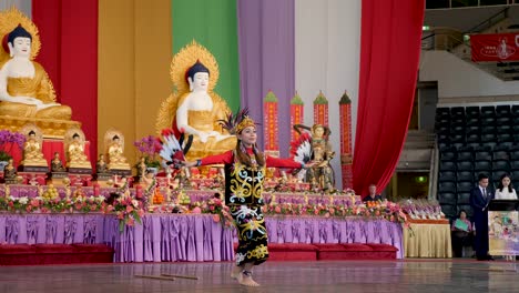 Indonesian-women-dancing-belly-dance-with-candle-holder-on-head-during-Buddha-Birthday-Festival,-Brisbane-2018