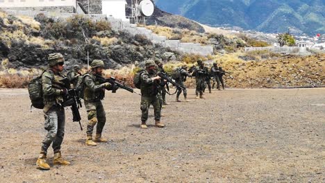Army-company-walking-in-a-shooting-range-a-firing-at-the-same-time