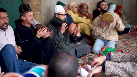 North-African-Sufi-ceremony-in-Essaouira,-Morocco,-with-men-playing-drums-and-chanting-creating-a-trance-like-state