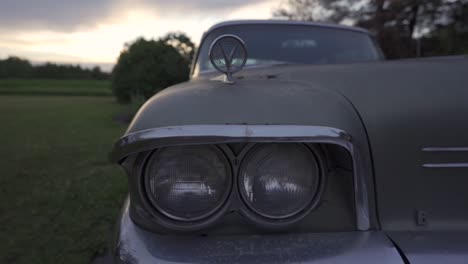 Front-Headlights-Of-Vintage-Classic-Buick-Car-Abandoned-Outdoors