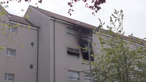 Wide-shot-of-a-burned-out-flat-in-an-urban-neighbourhood