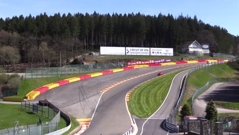 Timelapse-of-race-cars-at-Circuit-de-Spa-Francorchamps-passing-La-Source-hill