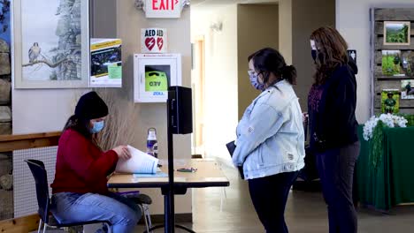 Two-college-students-come-to-their-polling-place-to-register-to-vote-for-a-general-election