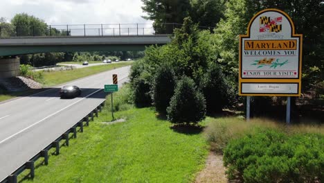 Maryland-Welcomes-You-sign,-Leaving-Pennsylvania,-entering-MD-on-Interstate-Route-83-South,-no-texting,-no-hand-held-cell-phone,-Mason-Dixon-Line