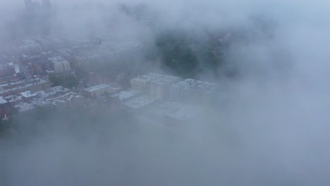 Aerial-descent-through-fog-clouds-onto-Upper-Manhattan-New-York-City