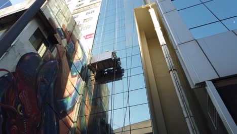 Skyscrapers-window-cleaning-and-washing-team-operating-in-downtown-Hong-Kong