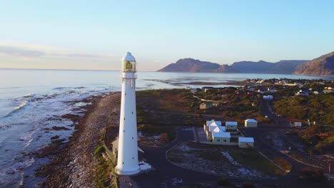 Aerial-view-of-a-rocky-beach-and-lighthouse-in-South-Africa