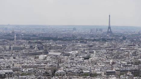 Zeitlupe:-Draufsicht-Des-Wunderschönen-Paris-Mit-Dem-Eiffelturm-Im-Hintergrund