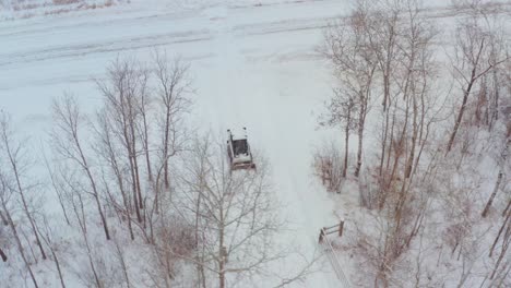 Clearing-snow-on-a-rural-property-with-a-wheeled-bobcat